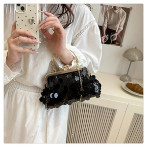 Elegant black sequin clutch bag with gold kiss-lock closure and metal chain strap detail