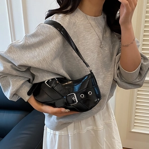 Chic black glossy underarm bag with vintage motorcycle style and silver metal buckles