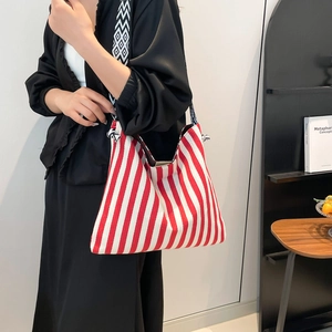 Minimalist red and white striped canvas tote bag with wide geometric pattern strap