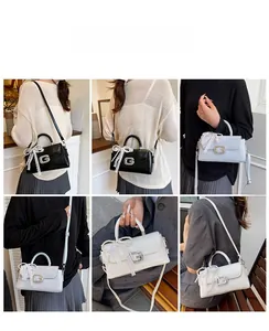 Detail of square lace crossbody bags with G-logo and pearl ribbon charms in 3 colors