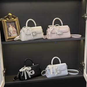 Stylish square handbags in four colors featuring pearl lace bows and a metal G logo