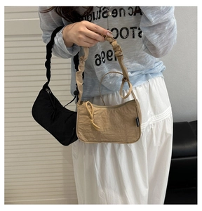 Comparison of black and khaki ruched hobo bags showing soft fabric and trendy shoulder straps