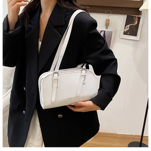 Minimalist white faux leather shoulder bag with adjustable straps and Fashion & Bag text