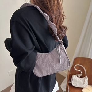 Light purple pleated hobo bag with adjustable wide shoulder strap for casual style