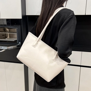 Minimalist creamy white leather tote bag with long straps for commute and large capacity
