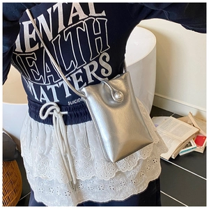 Crossbody phone bag in silver leather with a large pearl buckle and thin shoulder strap