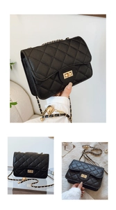 Detail of black quilted leather shoulder bag featuring a gold buckle and woven chain strap