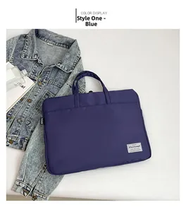 Detail of navy blue nylon laptop bag with durable handles and refined stitching finish