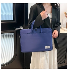 Detail of dark blue waterproof nylon bag with large main compartment and front pocket