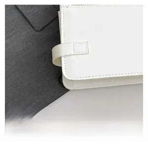 Macro shot of white PU leather material with litchi grain and precise stitching details