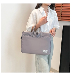 Detailed view of Morandi gray nylon laptop bag with waterproof fabric and dual zippers