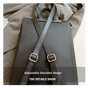Detail of adjustable black nylon backpack straps with Saffiano leather and silver buckles