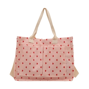 Pink corduroy tote bag with red hearts and large front pockets for summer fashion