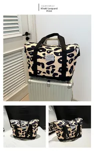 Leopard print travel bag on luggage showing waterproof fabric and large capacity