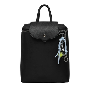 Fashionable black nylon backpack with leather flap and tennis racket keychain decor