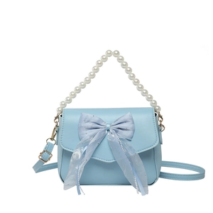 Light blue underarm bag with mesh bow, pearl handle, and adjustable shoulder strap