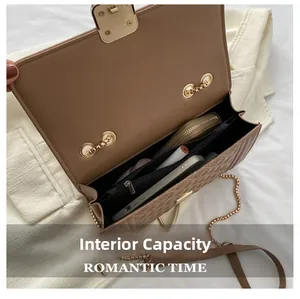 Internal capacity view of a quilted brown chain bag with compartments and zipper pocket