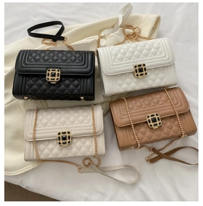 Flat lay of small quilted crossbody bags in black, white, cream and tan colors