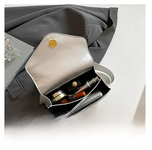 Interior view showing the capacity of the white bag for cosmetics and phone