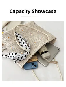 Interior capacity display of straw tote bag showing phone, tablet, and umbrella storage