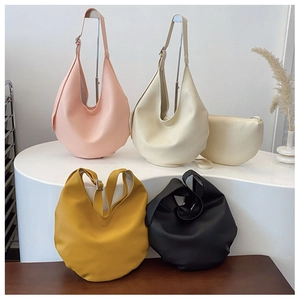 Selection of litchi grain bucket bags in pink, beige, yellow, and black colors