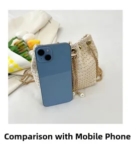 Detailed size comparison of beige woven bucket bag with phone and pearl gold chain