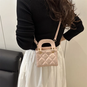 Pink quilted mini handbag for women with top handle and crossbody strap stylish design