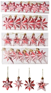 Detailed view of red and silver Christmas star ornaments with glitter and snowflake patterns