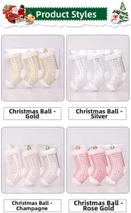Detail of glittery Christmas stocking ornaments in four metallic colors with gift box
