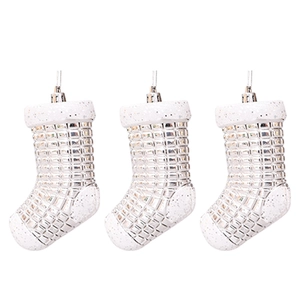 Close-up of silver plaid Christmas stocking ornaments with glittery white trim details