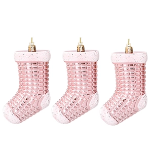 Three pink electroplated Christmas stocking ornaments with glitter details and grid texture