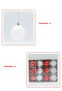 Macro detail of red and white painted Christmas baubles with snowflake patterns and silver strings