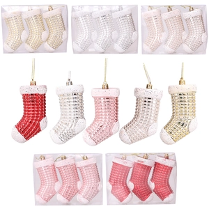 Glittery Christmas stocking boot ornaments in diverse metallic colors for holiday decor