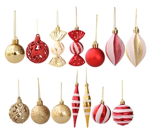 Detail of Christmas tree ornaments featuring red and gold baubles and candy shapes
