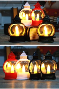 Detail van vintage LED-lantaarns in vier kleuren met ophangring en warm vlamlicht