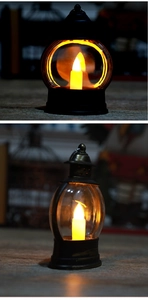 Detail van vintage LED-lantaarns in zwart en brons met warmgeel flikkerend schijnsel