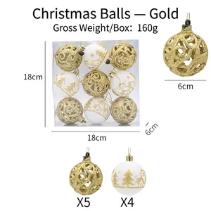 Detalle de bolas de Navidad de 6cm caladas en oro y blanco en caja de 18x18x6cm