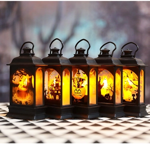 Set of 5 black LED Halloween lanterns with warm orange light and spooky silhouette designs