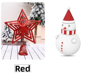 Detail of red glitter star tree topper and snowman ornament with spring base