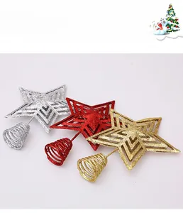 Close-up of glittery Christmas star tree toppers in gold, red, and silver with spring bases