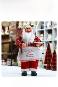 Detail of Santa Claus Chef figurine in red plaid shirt and apron with Welcome sign