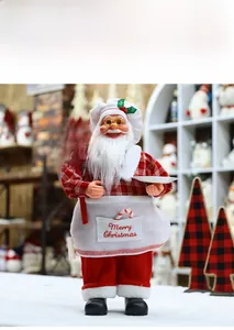 Detail of chef Santa Claus figurine holding a Welcome sign for Christmas decor