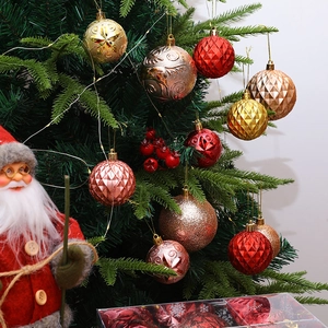 Set of 9 assorted red and gold Christmas ornaments hanging on a festive tree branch