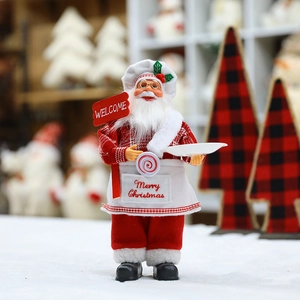 Chef Santa figurine with red plaid outfit and welcome sign for Christmas kitchen decor