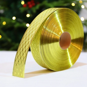 Metallic gold Christmas ribbon roll with mesh texture for elegant holiday gift wrapping