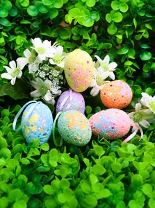 Detail of Easter egg ornaments with sequins and floral patterns in floral scene