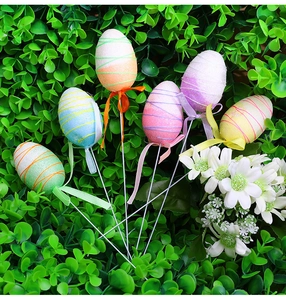Colorful Easter egg picks with glitter coating and ribbon bows for floral arrangements