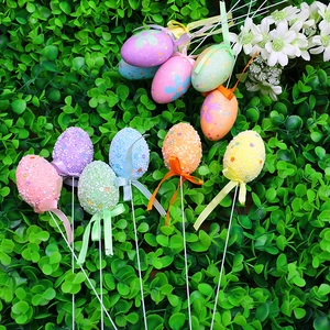 Easter egg floral picks with colorful foam eggs and ribbons for festive garden decoration
