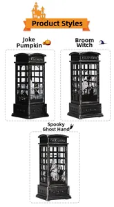 Detailed view of Halloween telephone booth lanterns featuring pumpkin and witch silhouettes