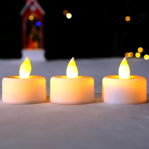 Set of three LED flameless tea light candles with warm yellow light for home decor